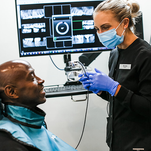 One of our team members working with a patient