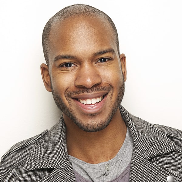 A patient smiling after a root canal